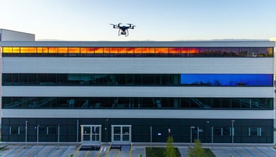 Drone performing a thermal inspection over a commercial building Drone performing a thermal inspection over a commercial building